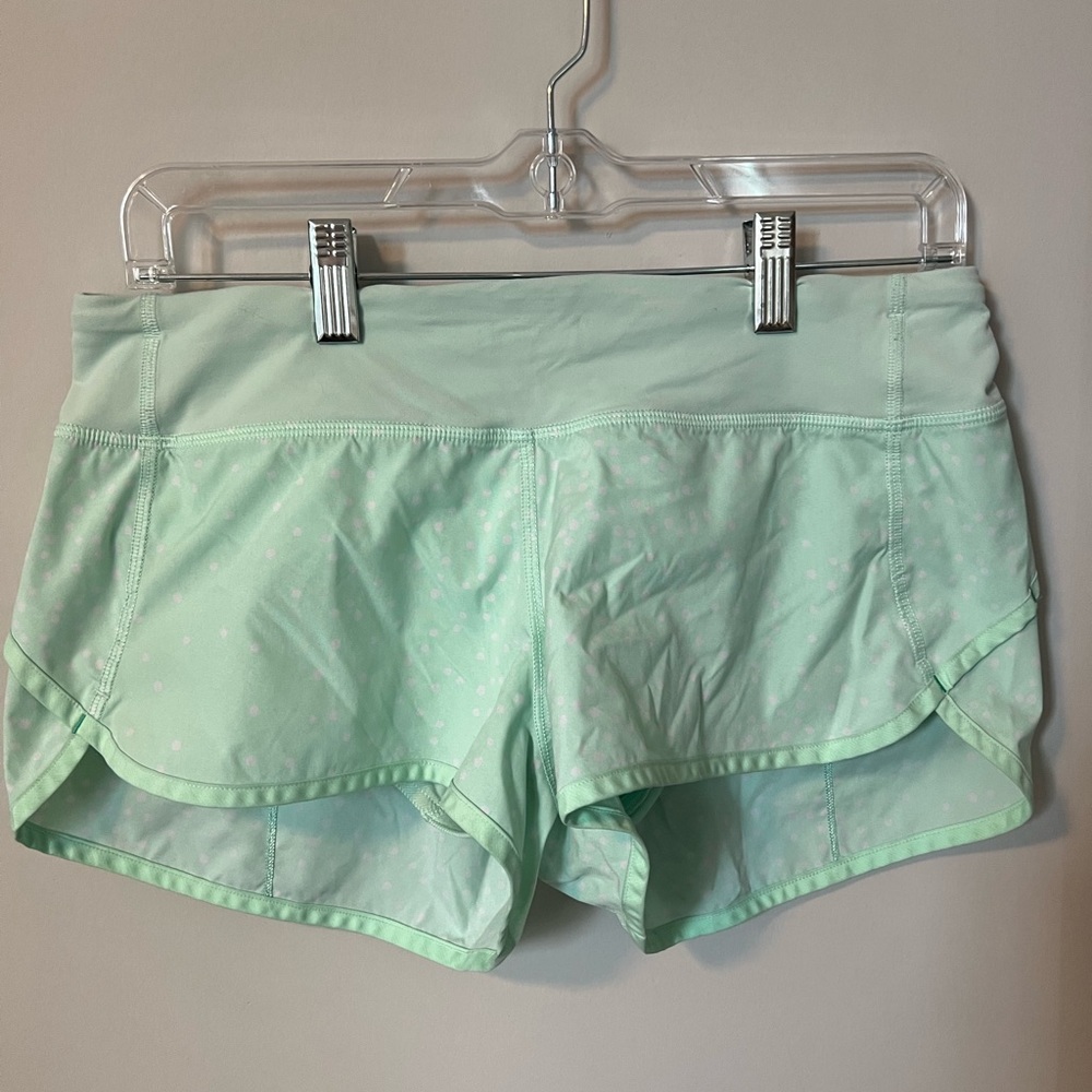Mint green lululemon shorts with white polka dots